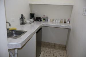 a kitchen with a sink and a counter top at Depa 1 sf2 in Hermosillo
