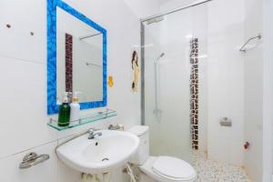 a bathroom with a sink and a toilet and a mirror at Homestay 30 Võ Thị Sáu in Vung Tau +42 photos