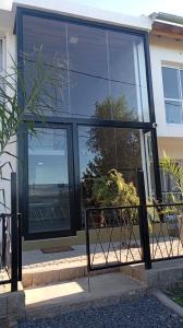 a building with large glass windows on the side of it at YulFran in Mina Clavero