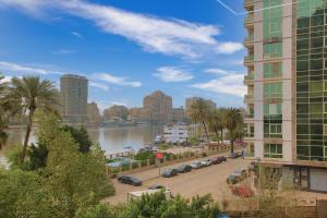 a view of a city with a river and buildings at Cairo Homes Nile View Studios Manial in Cairo