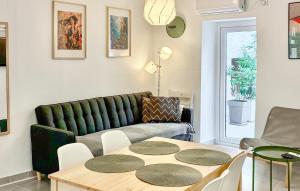 a living room with a couch and a table at Tiana in Vrsar