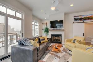 a living room with a couch and a fireplace at Downtown WP Loft 14 I Huge Hot Tub I Great Views I Additional Bunk Area I Activity Program in Winter Park