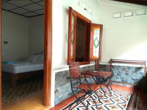 Voodi või voodid majutusasutuse Omah Pitoe Yogya Homestay toas