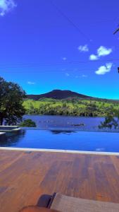 a view of a body of water from a house at Pousada Ipê do Lago in Capitólio