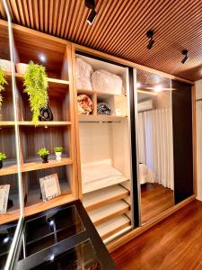 a room with wooden walls and wooden floors at Super comfortable house 3 bedrooms in Paranavaí