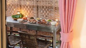 a table with plates of food on it at suncheon romance pension in Suncheon