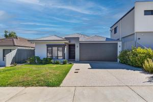 a large white house with a garage at DEAR8 - Madeley Retreat in Perth