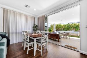 a dining room with a table and chairs at DEAR8 - Madeley Retreat in Perth