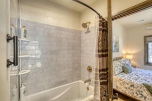 a bathroom with a tub and a shower at The Gold Hill Chalet in Keystone