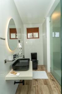 a bathroom with a black sink and a mirror at I Ahangama - 100m to Kabalana Beach in Ahangama +44 photos