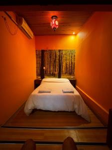 a bedroom with a large bed with a window at Prisamata in Salta