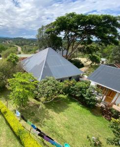 an aerial view of a house with a large roof at Kibale Eco-Home in Bigodi