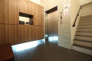 a hallway with a staircase and a stair case at Mr Lee Elevator B&B Hualien- Near Dongdamen Night Market in Ji'an