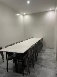 a long conference room with a long table and chairs at Norwil Manor Tagaytay in Tagaytay +63 photos
