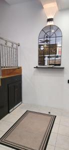 a room with a cage on the wall at #MyPawsomeGetaway, Fun Family Retreat, Tanah Rata, Cameron Highlands in Tanah Rata