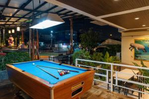 a pool table in the middle of a room at Xanadu Hotel Utapao in Rayong