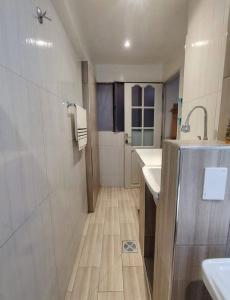 a bathroom with a shower and a sink and a mirror at La posada apartment in Cusco