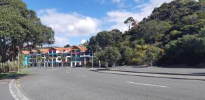 an empty road in front of a building at Tutukaka Marina Views in Tutukaka