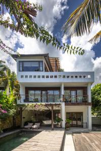 a house with a pool in front of it at Nami House Balian in Balian