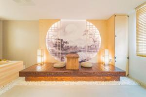 a room with a table and a painting on the wall at Yeonhwamoon Hotel Yangyang in Yangyang +54 photos