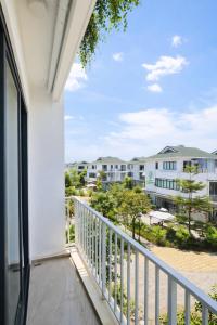 a balcony with a view of a building at Sunhouse Villa Huế in Hue