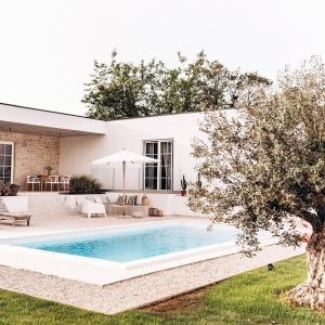 a pool in the backyard of a house at Villa Sunrise Labin Istria - a smile every day in Nedeščina