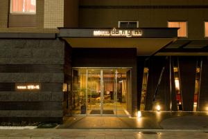 a building with a sign that reads hotel calhoun at Dormy Inn Premium Kyoto Ekimae Natural Hot Spring in Kyoto