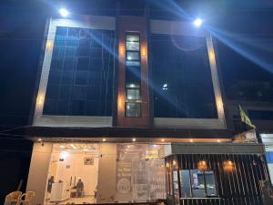 a building with lights on top of it at night at Fairview Anayaa in Khātu