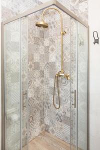 a shower with a glass door and a shower head at Villa Valeria in Rogoznica +51 photos