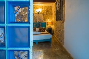 Postel nebo postele na pokoji v ubytování Chapel 5 Boutique Suites B&B