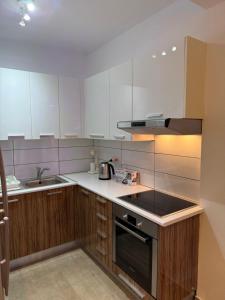 a kitchen with a sink and a stove top oven at 777 Stars in Paphos