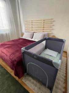 a bed in a bedroom with a blue frame at Anastasia's House in Florina