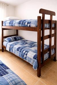 two bunk beds sitting next to each other in a room at Depto Termas Centro in Termas de Río Hondo