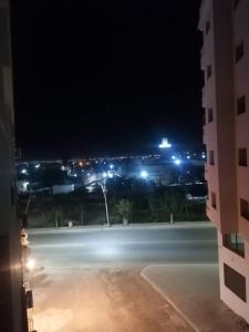a view of a parking lot at night at Résidences nour nador in Nador