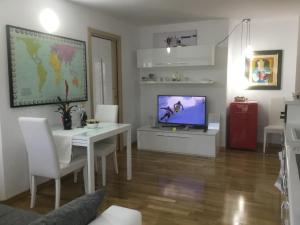 A television and/or entertainment centre at White Dream Suites