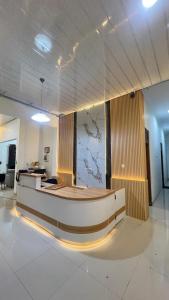 a lobby with a reception desk in a building at Guest House Primitif in Temon