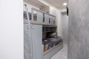 a small room with a bunk bed in it at Ali apartments in Pizzo