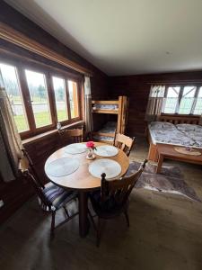 a room with a table and chairs and a bedroom at BUBLA CITY RANCH in Kopřivnice
