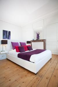 Säng eller sängar i ett rum på L'Esplanade Lille