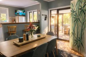 a dining room with a wooden table and chairs at Hidden Gem - St Mary's in Saint Marys
