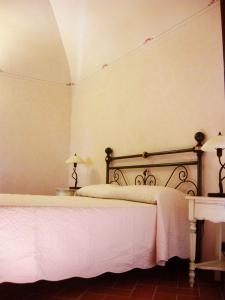 Postel nebo postele na pokoji v ubytování Relais Villa Sensano