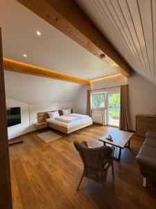 a bedroom with a bed and a couch and a table at Zum Kaiserwirt in Heppenheim an der Bergstrasse