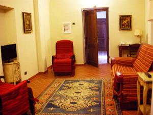 TV a/nebo společenská místnost v ubytování Relais Villa Sensano