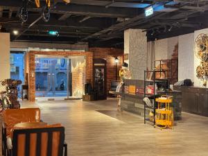 a room with chairs and tables in a store at Mazor Hotel Hualien Linsen in Hualien City