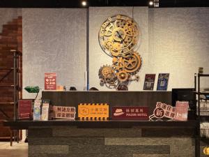 a large clock on top of a counter in a store at Mazor Hotel Hualien Linsen in Hualien City