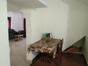 a table in a room with a table cloth on it at Brookfield estate villa 2bhk in Madikeri