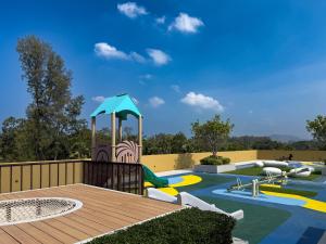 a playground with a slide and a water park at Laguna Seaside 3 bed #84195 in Bang Tao Beach