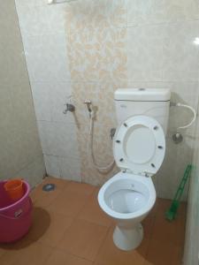 a bathroom with a toilet and a shower at Brookfield estate villa 2bhk in Madikeri +15 photos