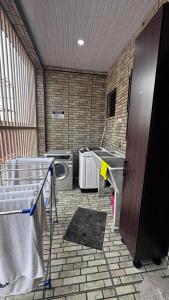 a bathroom with a bed and a sink and a toilet at Raza villa in Lautoka