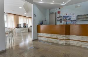 a lobby with a reception desk and a table at Hotel Levante Convenzionato con ACQUARIO DI CATTOLICA in Riccione +51 photos